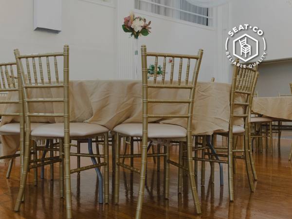 Golden Chiavari chairs at an event