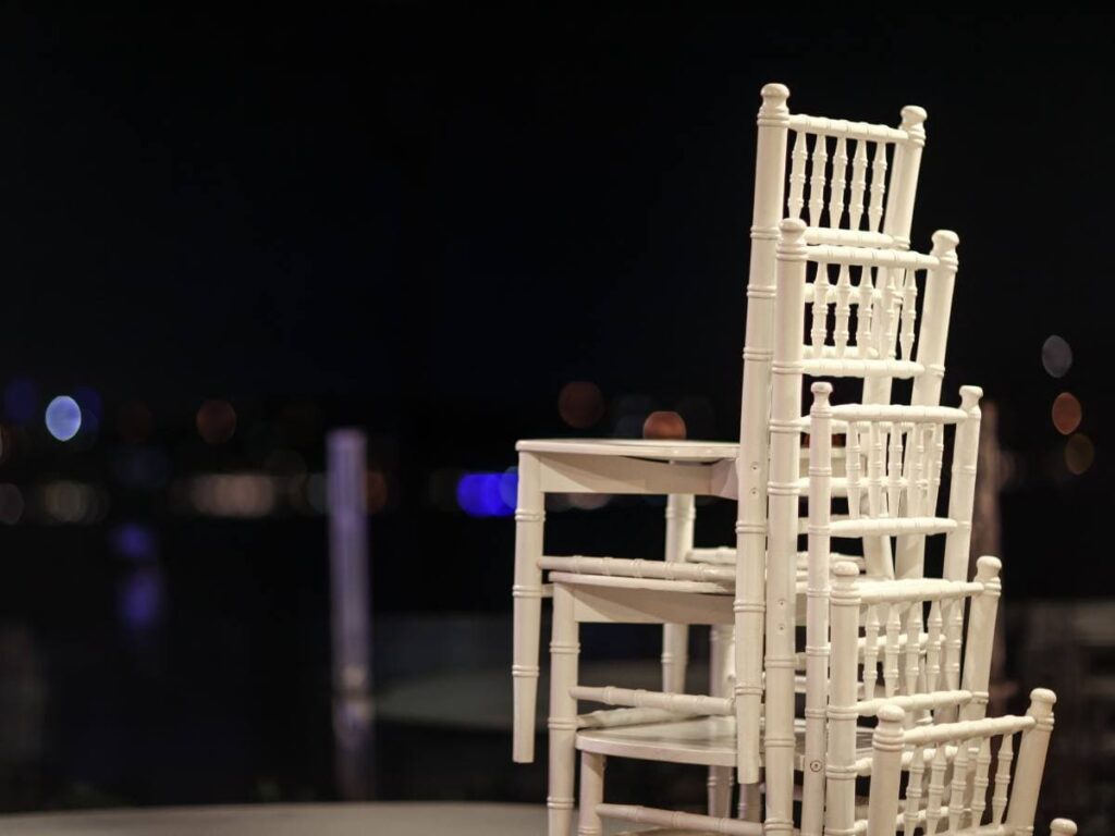 Stacking Chiavari chairs with a event background