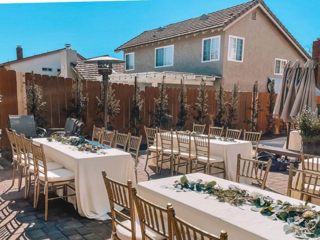 gold chiavari chairs in an outdoor event to start party rental